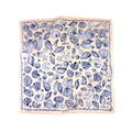 A square scarf featuring a blue seashell-and-starfish pattern on a peachy-pink background, with a matching pink border. Look closer & you will see the white heart and mahjong-embroidered script in the corner.