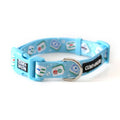 A bright blue dog collar with a pattern of colorful classic mahjong tiles and a black brand silicone patch that reads 'CLIVE & BACON'.